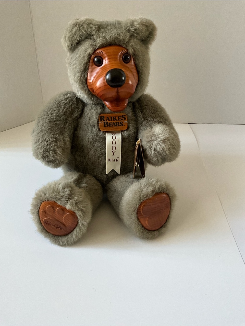 Raises Woody Bear Plush in Gray with Wooden Face